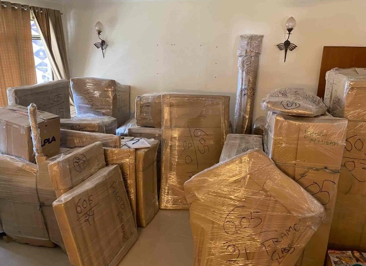 cardboard boxes are wrapped in a plastic cover